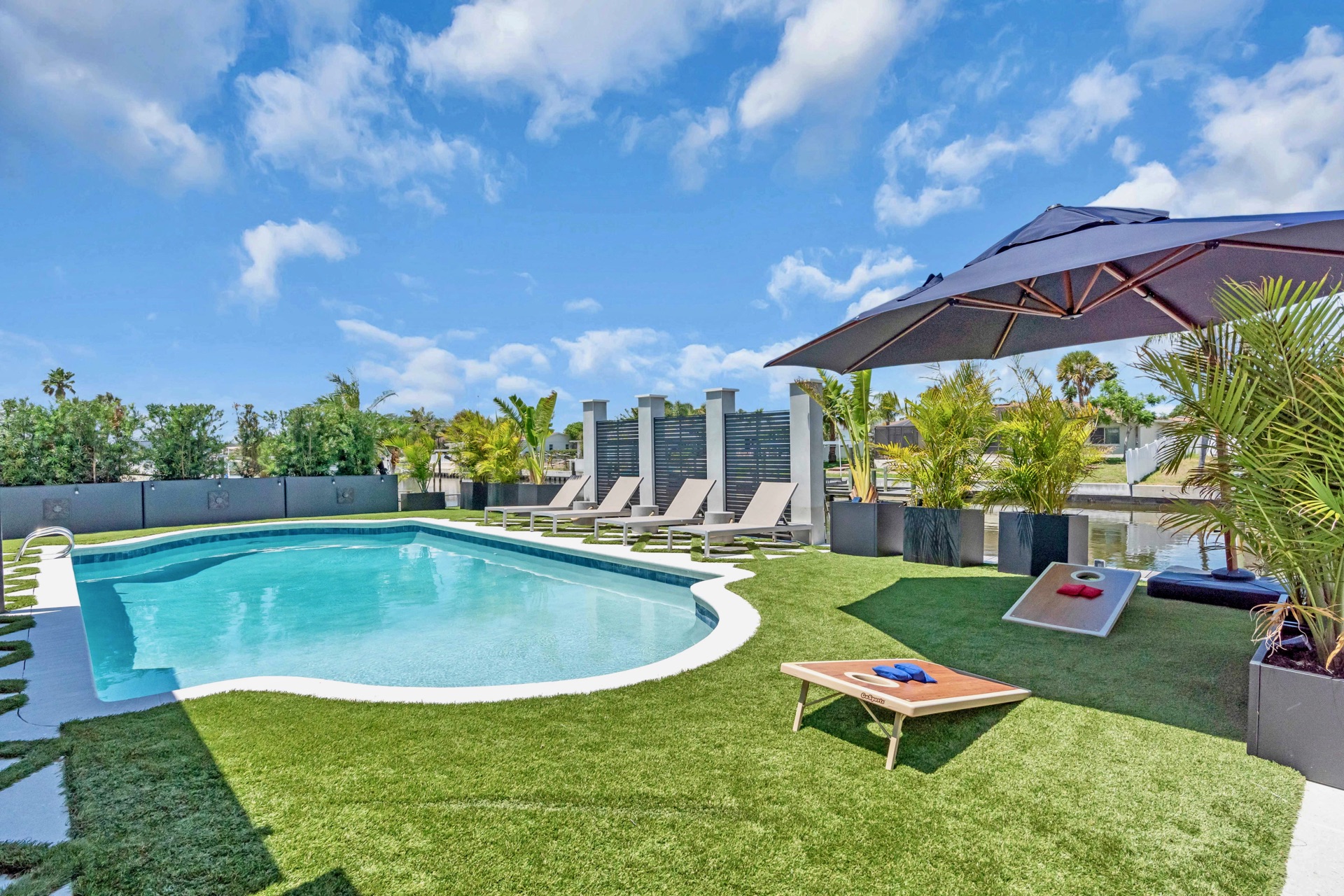 Private pool and lounge area at dusk, Tampa luxury waterfront vacation rental